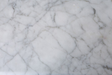 Elegant white marble surface with subtle gray veins showcasing natural beauty and texture in a modern setting