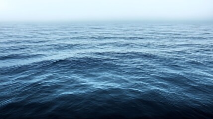 Fototapeta premium Serene Ocean Waves Under a Misty Sky
