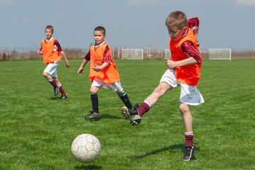 Boys play soccer sports field