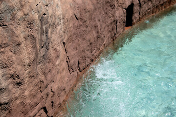 Light blue swimming pool bottom with clear water surface textured background