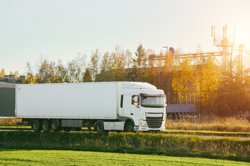 Industrial truck near forested area sunrise