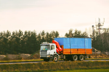 Fototapeta premium Transport truck with container and crane