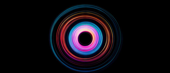 Colorful long exposure light trails of a ferris wheel against a black background