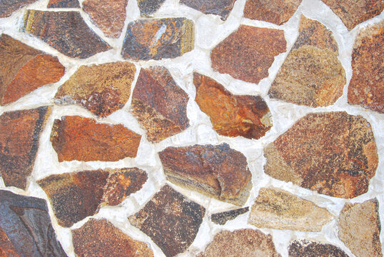 Natural rubble stone wall texture as background