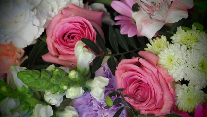 bouquet of flowers close up . pink roses, purple and white carnations, lilies . copy space . wedding bouquet . mother's day . many flowers