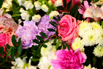 bouquet of flowers close up . pink roses, purple and white carnations, lilies . copy space . wedding bouquet . mother's day