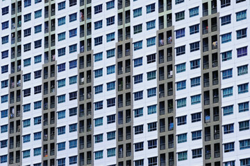 Obraz premium Windows of big building is condominium or apartment in the big city, full frame background.