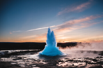 Strokkur Geysir eruption at sunset in south Iceland, Haukadalur valley © _mishamartin