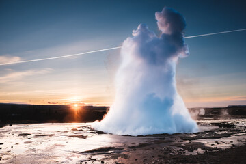 Strokkur Geysir eruption at sunset in south Iceland, Haukadalur valley © _mishamartin