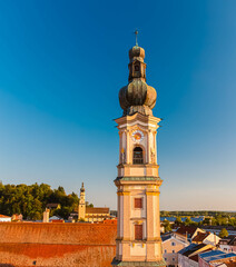 A church and another church in the background on a sunny summer day seen from a ferris wheel at Deggendorf, Danube, Bavaria, Germany