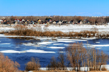 Spring landscape, a small village in early spring in sunny weather, bird's eye view © syntheticmessiah