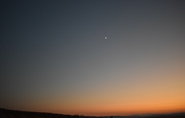 Moon with an orange skyline