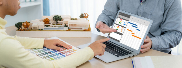 Project planning software for brisk business project management on the computer screen showing...
