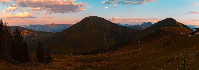 High resolution stitched alpine sunset summer panorama or sundowner at Alpenrosenbahn Westendorf,...
