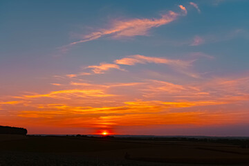 Fototapeta premium Sunset with clouds near Westerndorf, Wallersdorf, Dingolfing-Landau, Bavaria, Germany