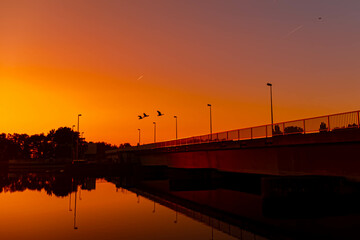 Sunset with reflections near Plattling, Isar, Bavaria, Germany