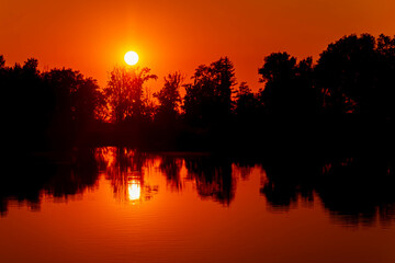 Sunset with reflections near Plattling, Isar, Bavaria, Germany