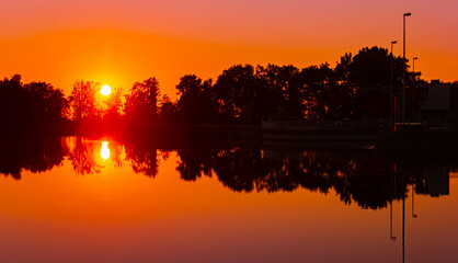 Sunset with reflections near Plattling, Isar, Bavaria, Germany
