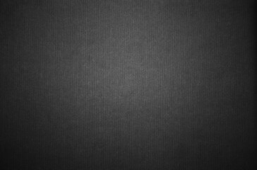 Black corrugated paper or cardboard texture as background