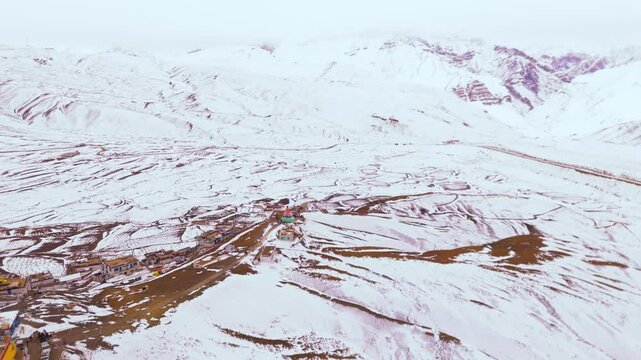 snow covered spiti valley with ariel view of kibber village