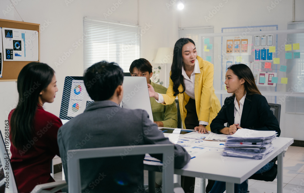 Poster group of young asian businesspeople analyzing financial statistics displayed on a computer screen, c
