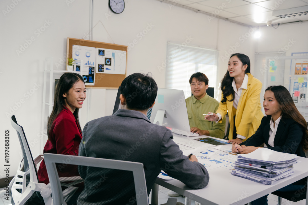 Poster Five business professionals collaborating on a project, analyzing data and discussing strategies during a productive office meeting, fostering teamwork and innovative solutions