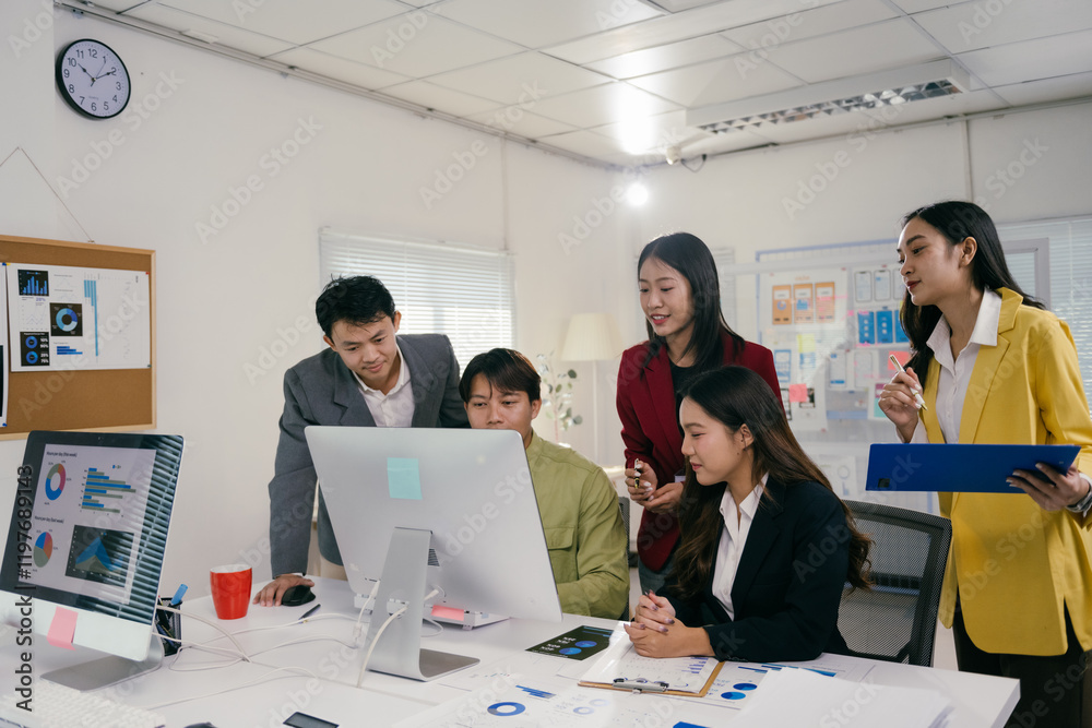 Aufkleber five asian businesspeople collaborating on a project, analyzing charts and graphs on a computer scre