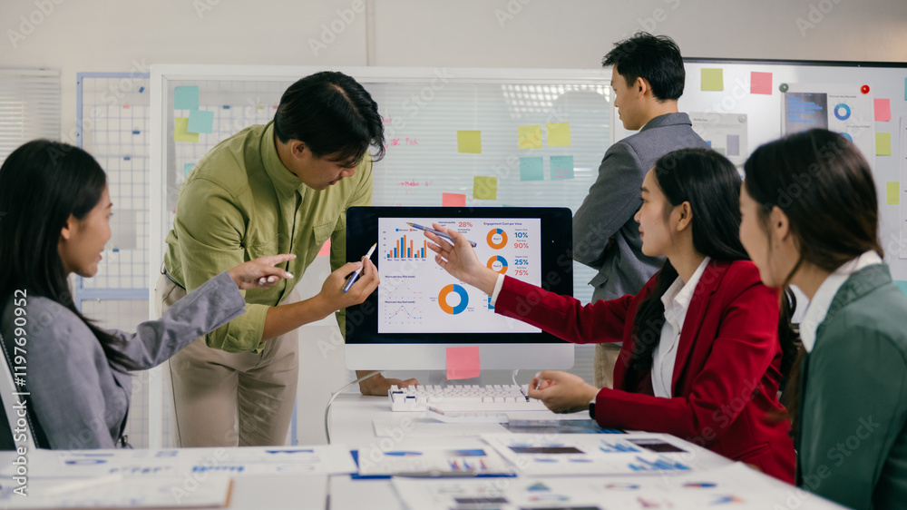 Poster diverse group of asian professionals collaborating on a project, analyzing charts and graphs on a co
