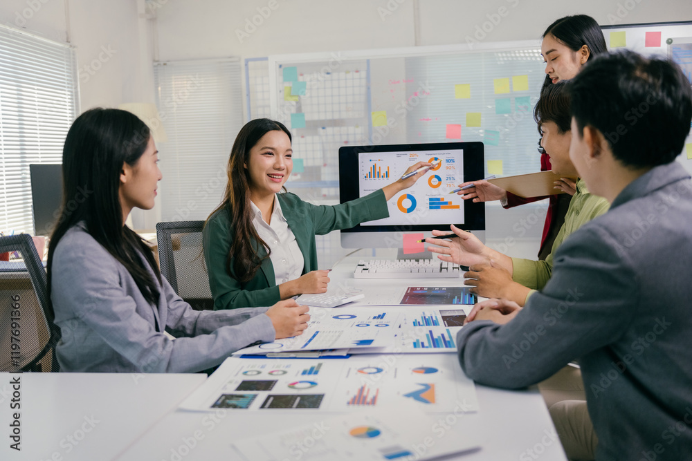 Poster group of young asian businesspeople discussing financial data and analyzing charts on a computer scr