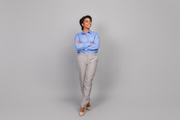 Full size photo of pretty young bussinesswoman crossed hands confident look empty space wear trendy...