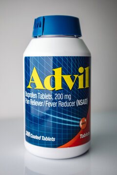 Bottle of Advil Ibuprofen pills on white background