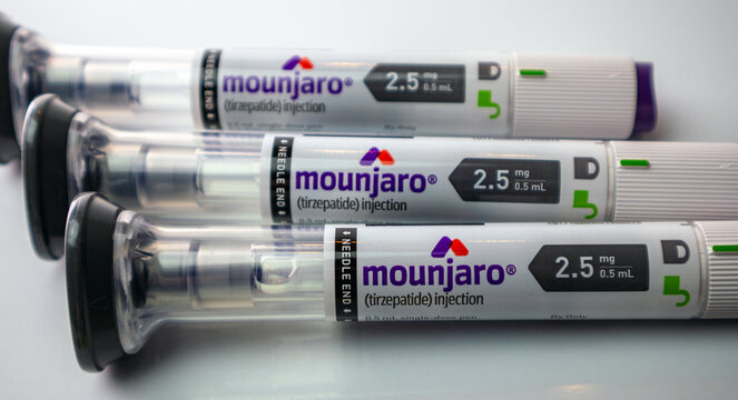 Close up of three Mounjaro pens on white background 