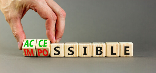 Accessible or impossible symbol. Concept words Accessible or Impossible on beautiful wooden blocks. Beautiful grey table grey background. Business accessible or impossible concept. Copy space.