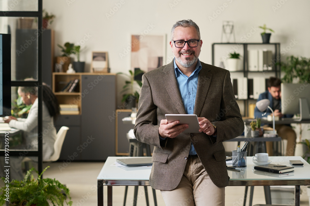 Aufkleber successful director of business company with tablet in hands looking at camera while learning online