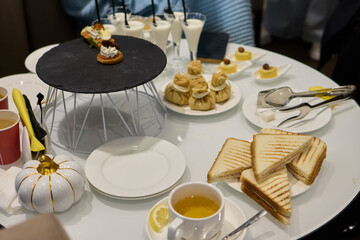 An Elegant Assortment of Gourmet Desserts and Savory Snacks Beautifully Arranged on Table