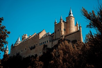 Fototapeta premium Alcazar of Segovia under a clear blue sky