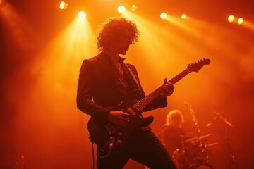 a man in a suit playing an electric guitar