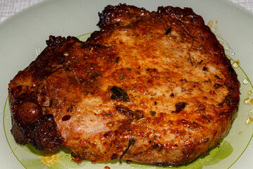 Pork steak is cooked in an air grill