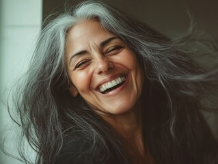 Fototapeta premium Smiling Woman with Wind-Swept Hair