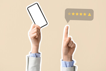 Businesswoman with mobile phone pointing at something on beige background