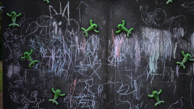 Playground children abstract drawing on black baord