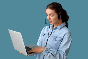 Female technical support agent with laptop on blue background