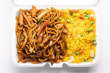 Foam container with Chinese restaurant takeout food lo mein noodles and yellow fried rice