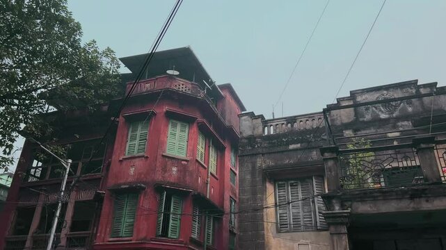 Traditional old red Zamindar building in poor condition at Kolkata, India.