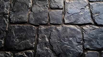 Obraz premium Dark Stone Wall Texture with Rough Surface and Unique Patterns