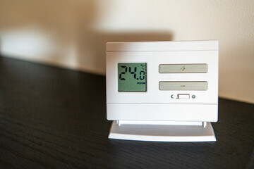 Adjustable thermostat for indoor heating