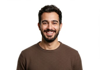 A smiling man with dark hair and a trimmed beard, wearing a brown sweater, standing casually, isolated on a white background