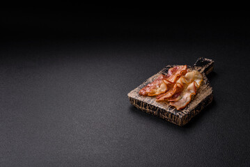 Delicious bacon in the form of slices with salt, spices and herbs
