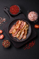 Delicious bacon in the form of slices with salt, spices and herbs
