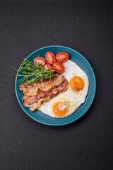 A hearty breakfast with fried eggs, bacon, tomatoes, microgreens